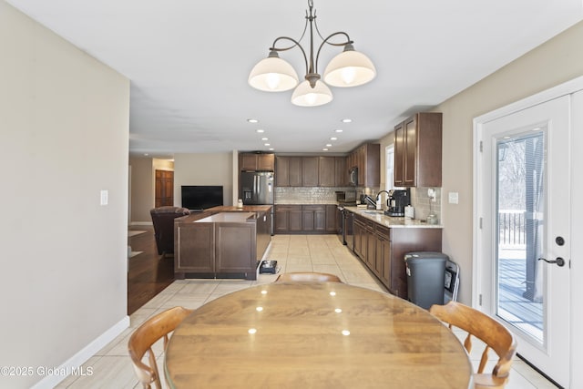 419 Brownell Rd, Malta, NY 12020 - dining space featuring recessed lighting, light tile patterned floors, baseboards, and an inviting chandelier