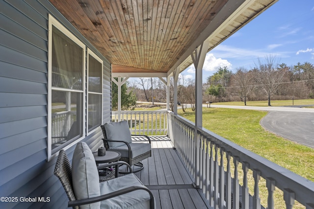 419 Brownell Rd, Malta, NY 12020 - deck with a lawn and covered porch