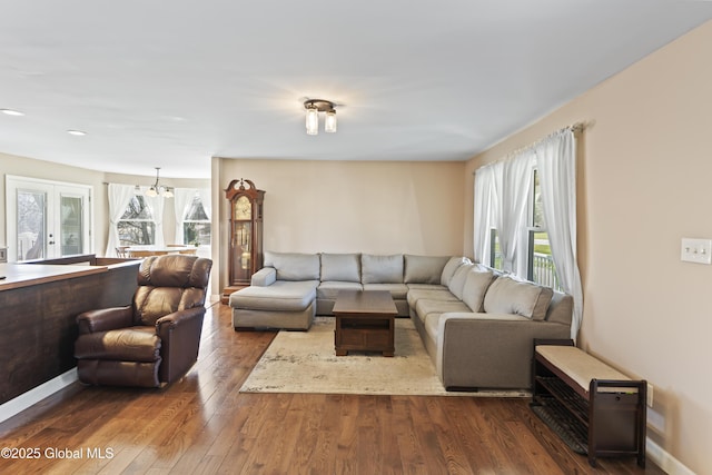 419 Brownell Rd, Malta, NY 12020 - living area with a chandelier, baseboards, dark wood finished floors, and a wealth of natural light