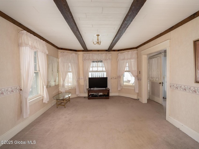16 Oakwood Blvd, Hudson, NY 12534 - unfurnished living room with light carpet and beam ceiling