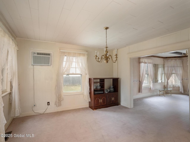 16 Oakwood Blvd, Hudson, NY 12534 - unfurnished living room featuring a chandelier, a wall mounted AC, healthy amount of natural light, and carpet floors