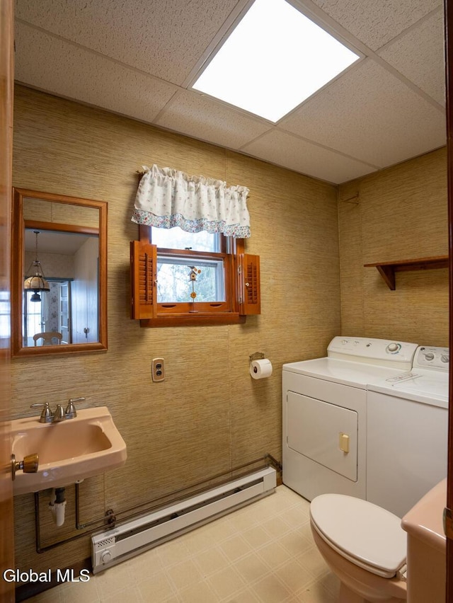 16 Oakwood Blvd, Hudson, NY 12534 - bathroom featuring baseboard heating, independent washer and dryer, a drop ceiling, plenty of natural light, and tile patterned floors