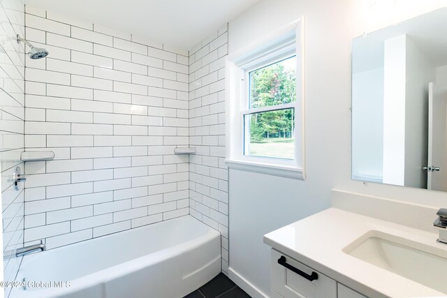 full bathroom featuring washtub / shower combination and vanity