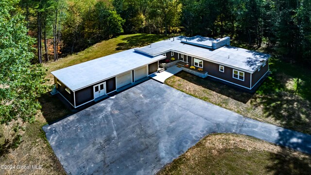 drone / aerial view with a view of trees