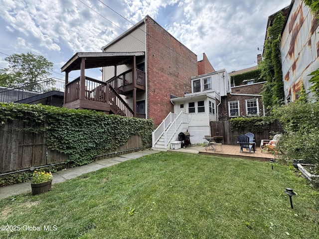 100 3rd St, Troy, NY 12180 - back of property featuring a fenced backyard, a wooden deck, and stairs