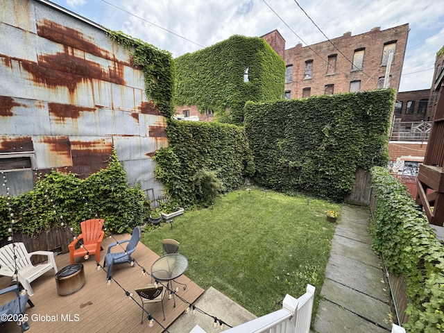 100 3rd St, Troy, NY 12180 - view of green lawn with a wooden deck