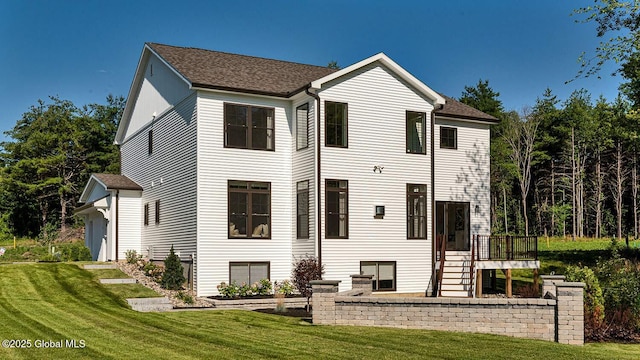 16 Bergen Pl, Niskayuna, NY 12309 - rear view of house with a shingled roof and a lawn