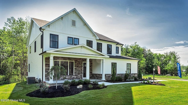 16 Bergen Pl, Niskayuna, NY 12309 - view of front of house featuring a porch, stone siding, a front lawn, and central AC