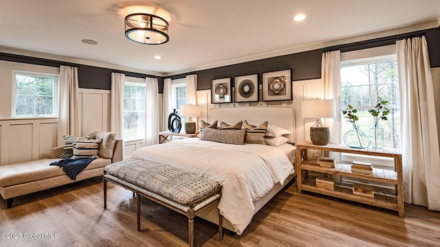 16 Bergen Pl, Niskayuna, NY 12309 - bedroom with a decorative wall, wood finished floors, recessed lighting, and a wainscoted wall