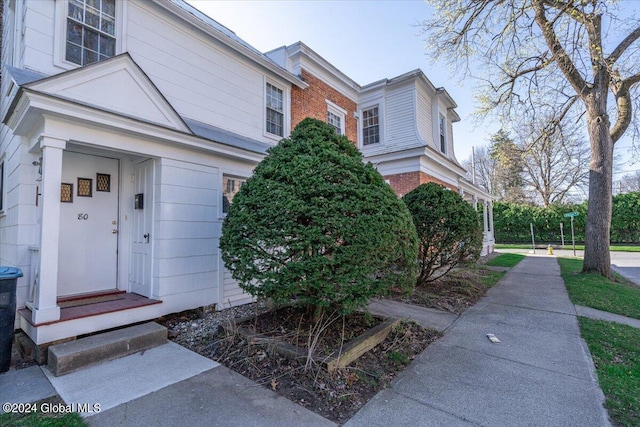view of front of property featuring brick siding