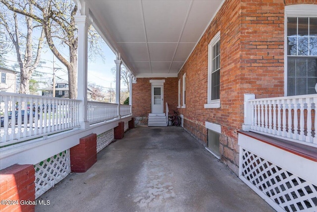 view of patio featuring an attached carport and entry steps