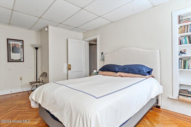 bedroom featuring a drop ceiling