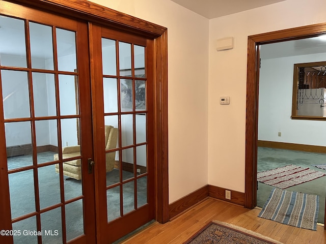 22 Williams St, Whitehall Village, NY 12887 - hallway featuring french doors, baseboards, and wood finished floors