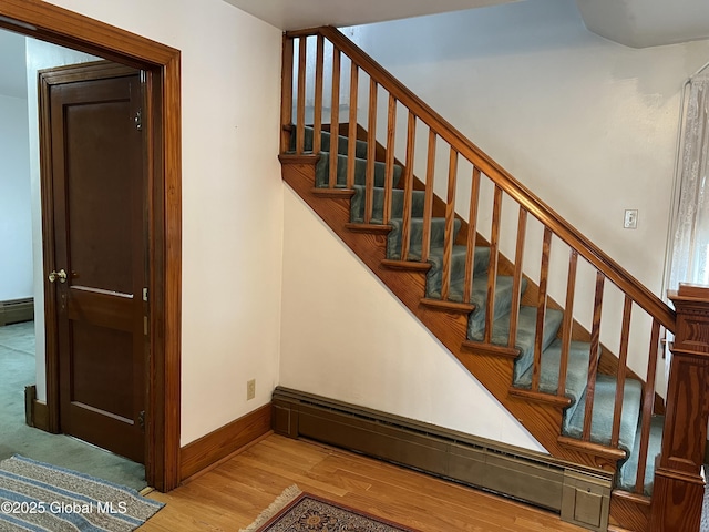 22 Williams St, Whitehall Village, NY 12887 - stairs with baseboards, wood finished floors, and baseboard heating