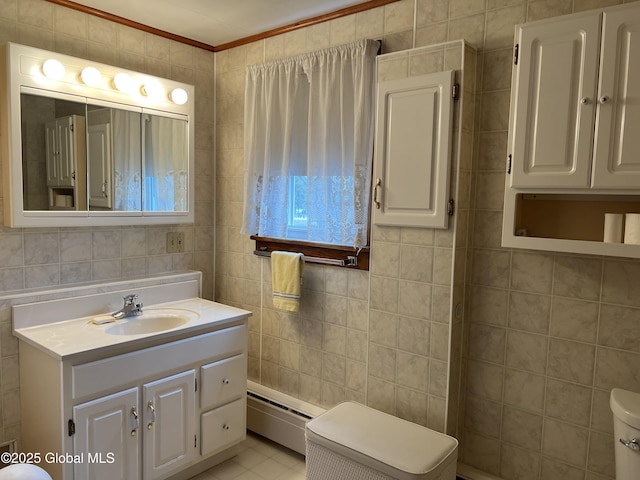 22 Williams St, Whitehall Village, NY 12887 - bathroom with vanity, a baseboard heating unit, tile patterned floors, toilet, and tile walls