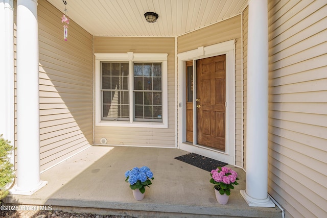 property entrance with covered porch