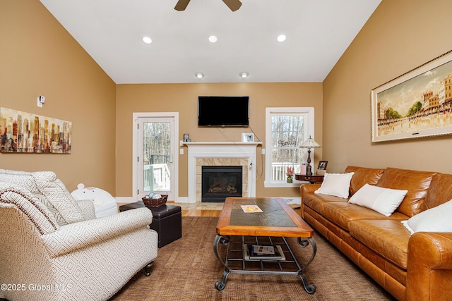living area featuring recessed lighting, a wealth of natural light, and a ceiling fan