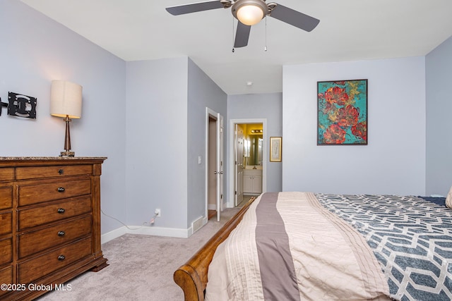 bedroom with visible vents, a ceiling fan, ensuite bath, baseboards, and light colored carpet