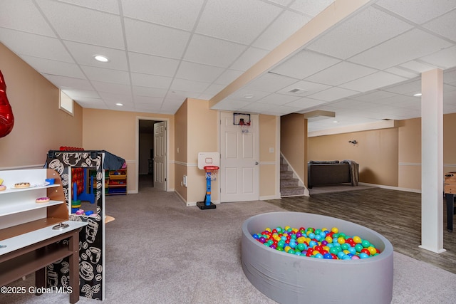 recreation room with baseboards, carpet flooring, a paneled ceiling, and recessed lighting