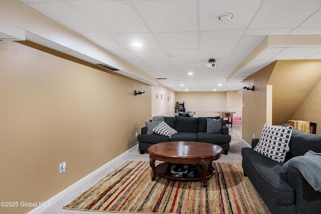 living room featuring a paneled ceiling, visible vents, carpet, and recessed lighting