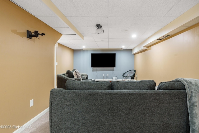 carpeted living room featuring recessed lighting, visible vents, a drop ceiling, and baseboards