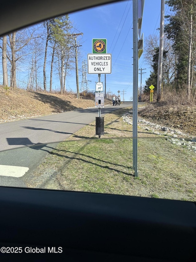 view of road with traffic signs