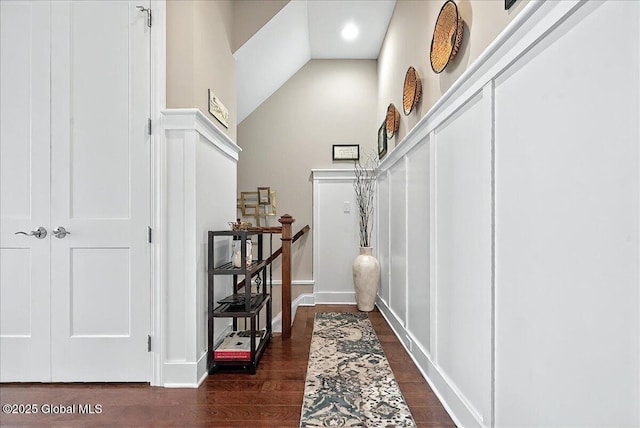 interior space featuring high vaulted ceiling and dark wood finished floors