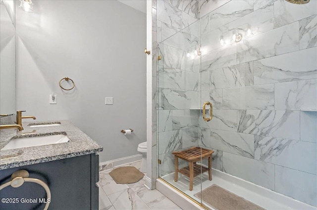 full bathroom with a sink, double vanity, toilet, marble finish floor, and a stall shower