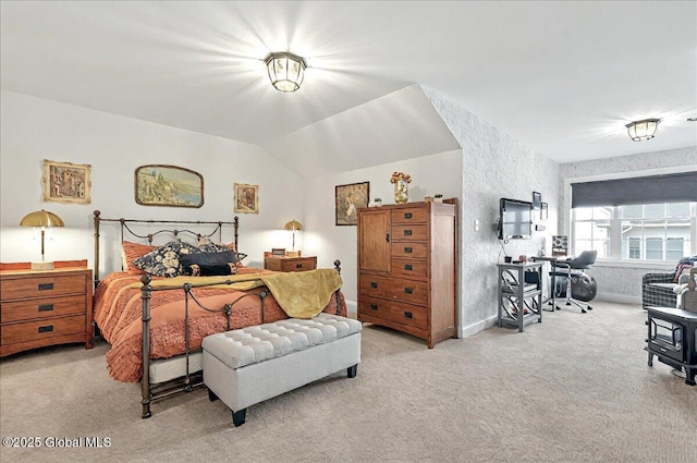 bedroom featuring vaulted ceiling and light carpet