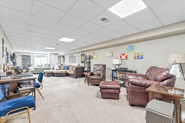 carpeted living room with a paneled ceiling and visible vents