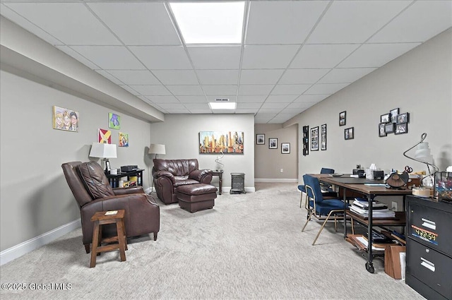 living room featuring baseboards, visible vents, carpet flooring, and a paneled ceiling