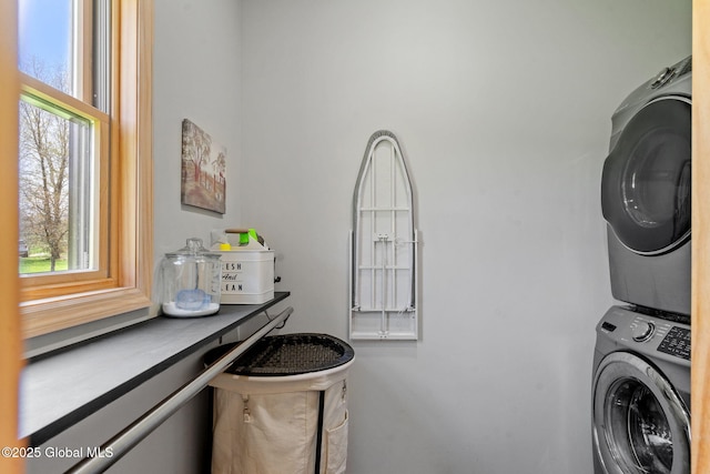 laundry room with laundry area and stacked washer and clothes dryer