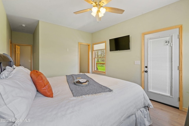 bedroom featuring light wood-style flooring and ceiling fan