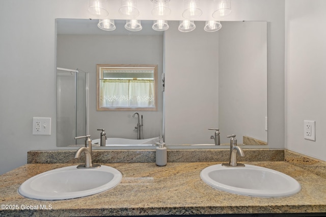 full bath with double vanity, a shower stall, and a sink