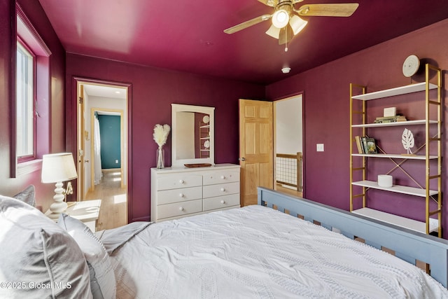 bedroom with a ceiling fan and wood finished floors