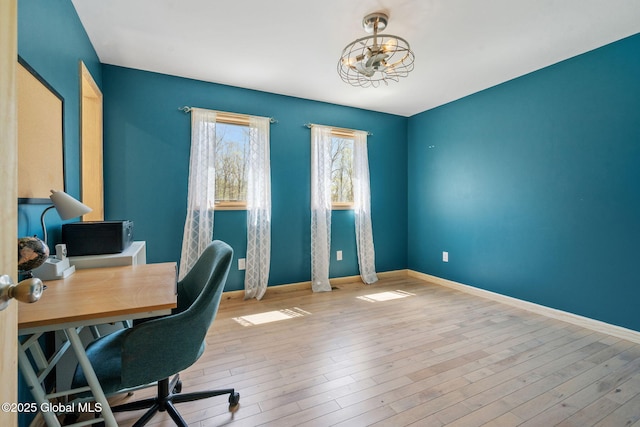office space featuring baseboards and hardwood / wood-style floors