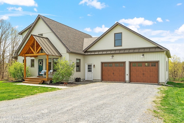 modern inspired farmhouse with roof with shingles, an attached garage, metal roof, a standing seam roof, and gravel driveway