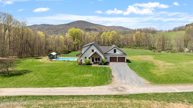 bird's eye view featuring a view of trees and a mountain view