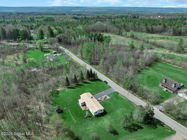 bird's eye view featuring a forest view