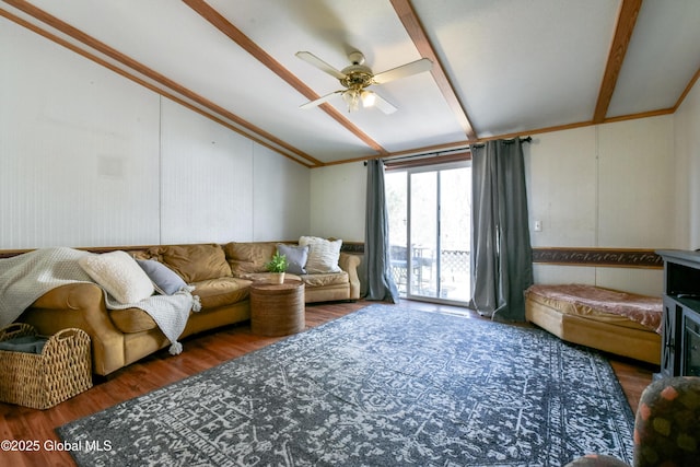 living room featuring wood finished floors, ceiling fan, and vaulted ceiling