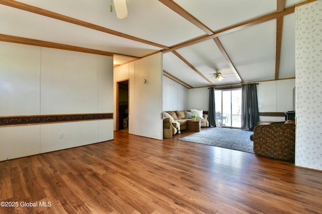 living room with wood finished floors, lofted ceiling with beams, and a ceiling fan