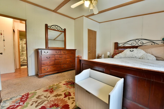bedroom with light carpet and a ceiling fan