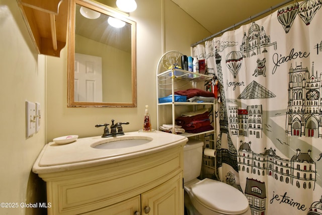 bathroom with vanity, a shower with curtain, and toilet