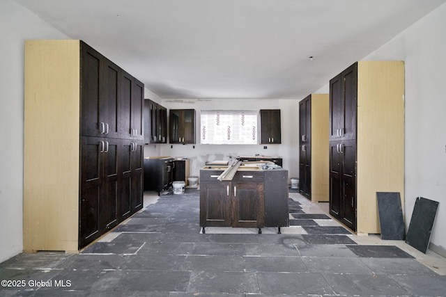 5 White Rd, Milton, NY 12020 - kitchen with a center island and dark brown cabinets