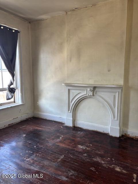 3 Osborne St, Albany, NY 12202 - unfurnished living room featuring baseboards and dark wood-style flooring