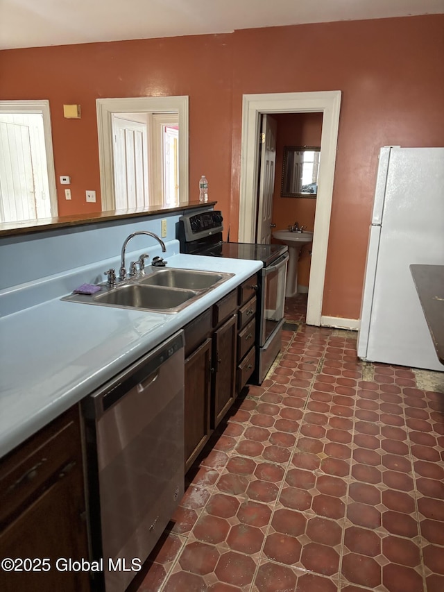 3 Osborne St, Albany, NY 12202 - kitchen with appliances with stainless steel finishes, light countertops, and a sink