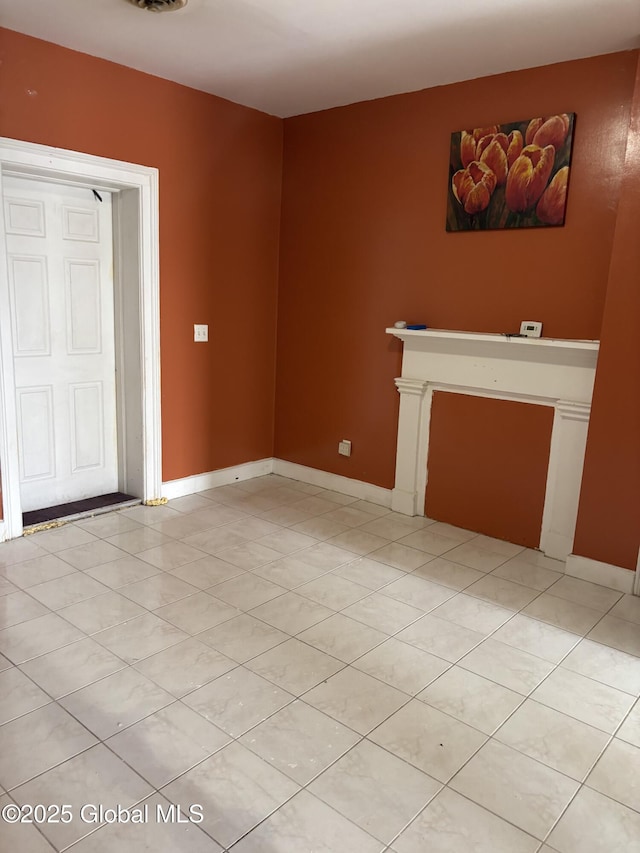 3 Osborne St, Albany, NY 12202 - unfurnished living room featuring light tile patterned floors and baseboards