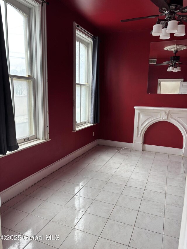 3 Osborne St, Albany, NY 12202 - unfurnished living room with baseboards, visible vents, light tile patterned floors, and a notable chandelier