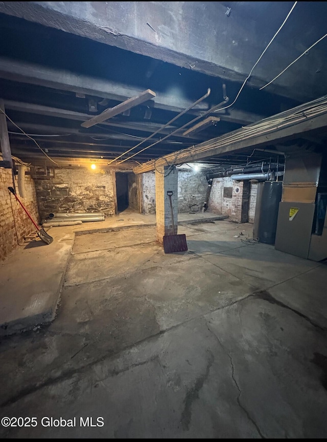3 Osborne St, Albany, NY 12202 - unfinished basement featuring heating unit and water heater