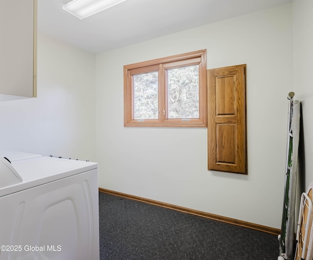 clothes washing area featuring baseboards, laundry area, and washing machine and dryer